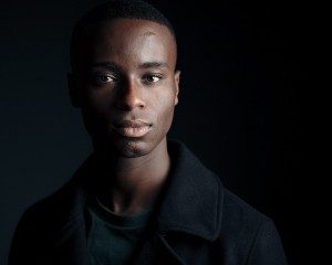 dark moody headshot of young black actor taken by Kim Hardy in his London photography studio