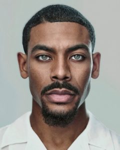 striking Headshot of Aaron Pierre taken by Kim Hardy headshot photographer in London studio in front of a white background