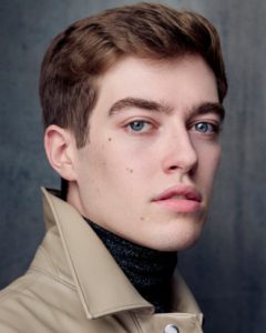 Headshots of young actor with blue eyes and light jacket taken by photographer Kim Hardy in his London studio in front of a greyish background